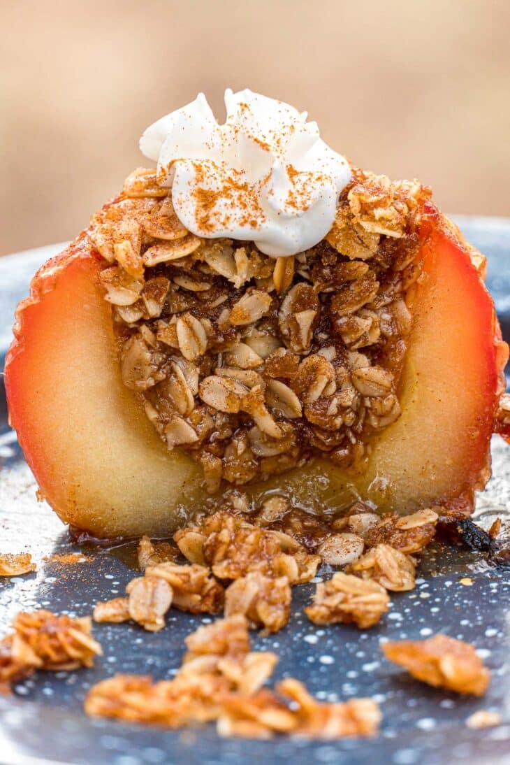 An apple cut in half to reveal oat and sugar filling.