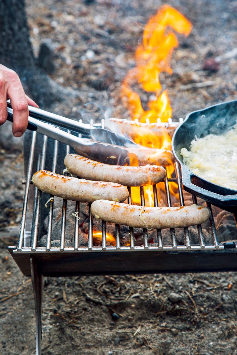 Beer brats on a campfire grill