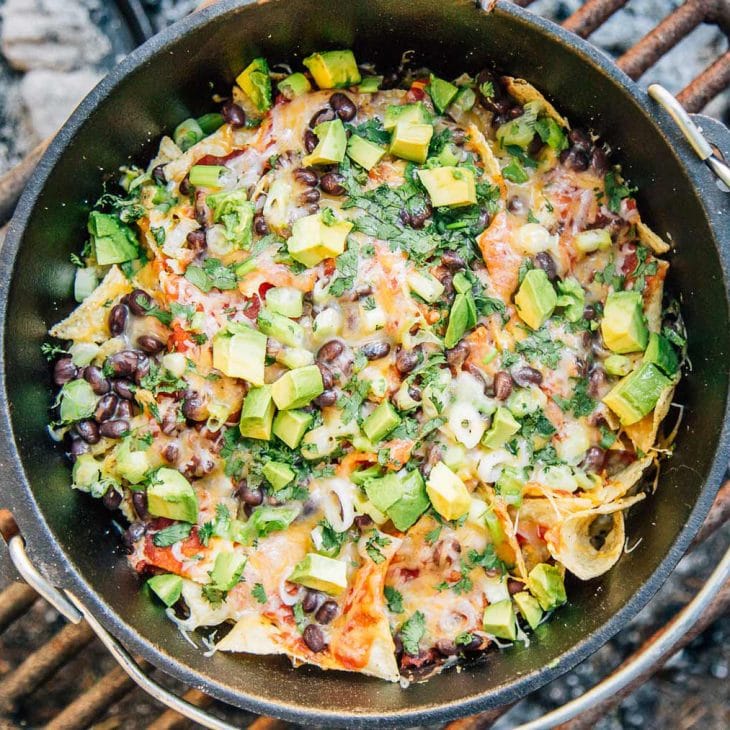 Nachos in a Dutch oven on a campfire grate