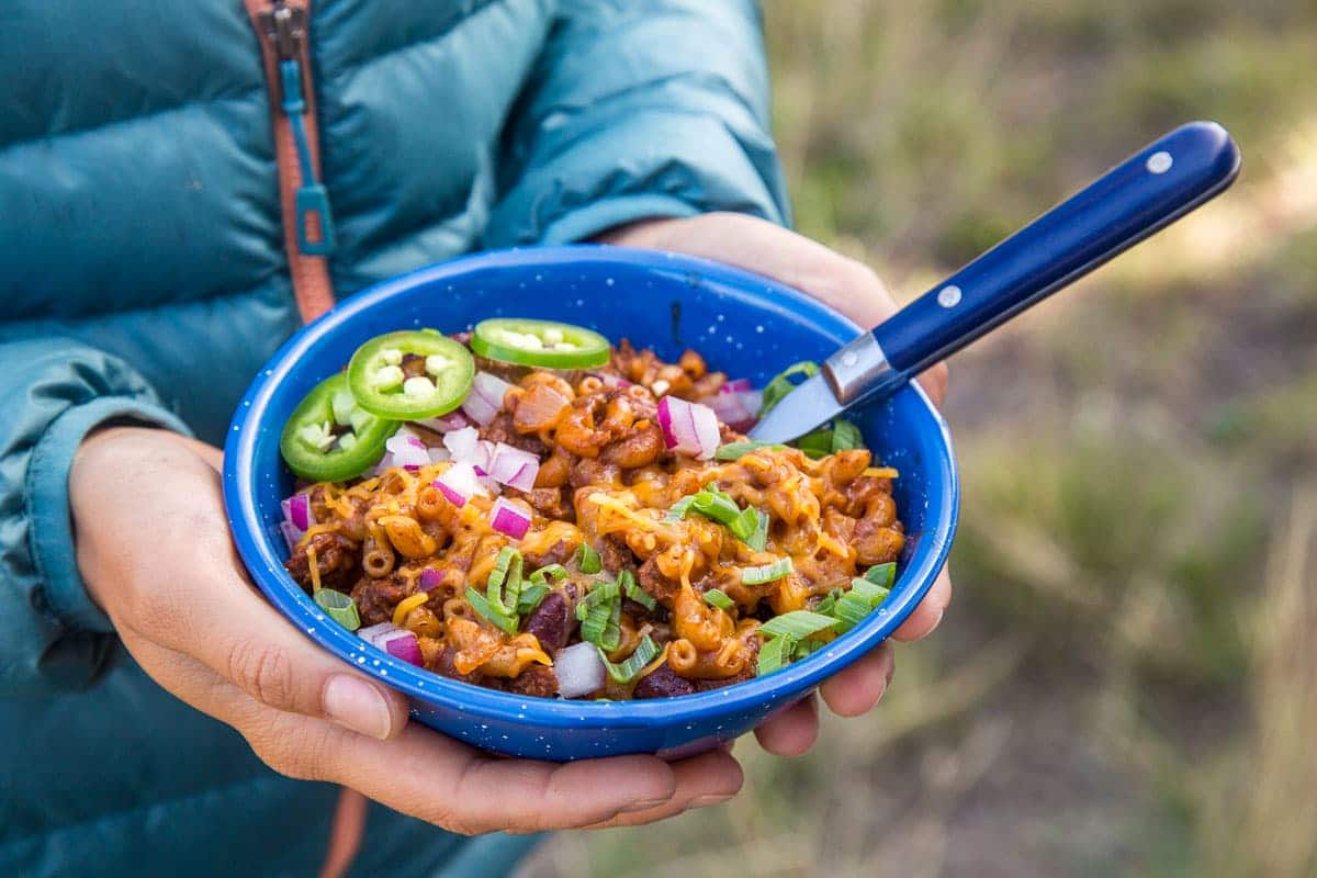 Megan holding a bowl of chili mac