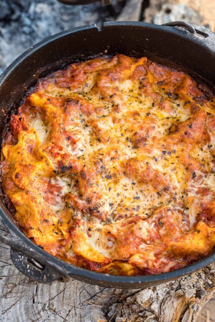 Dutch oven lasagna on a log