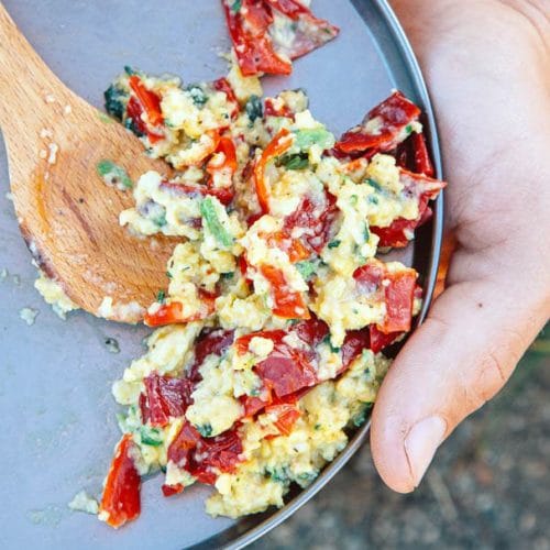 Scrambled eggs and red peppers on a plate