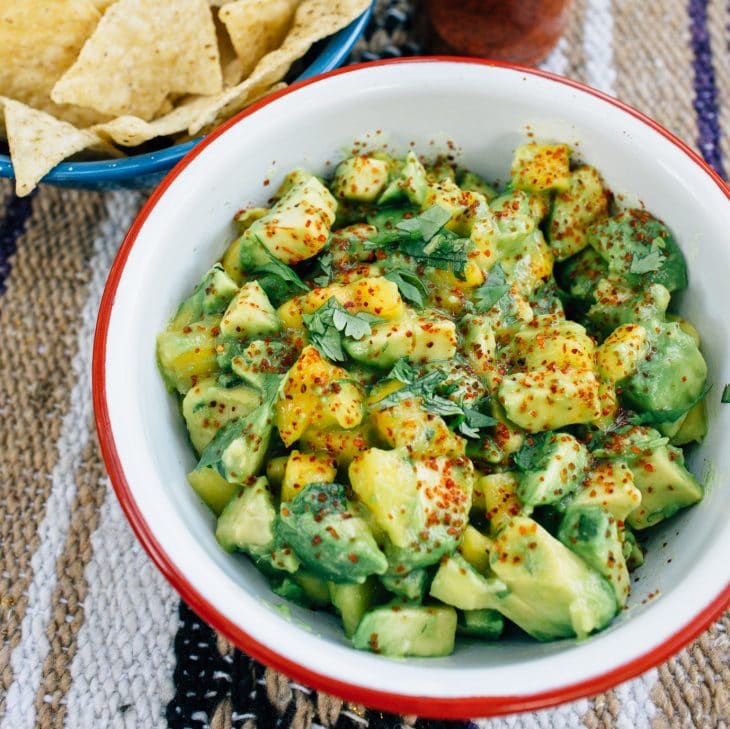 Guacamole in a white and red bowl