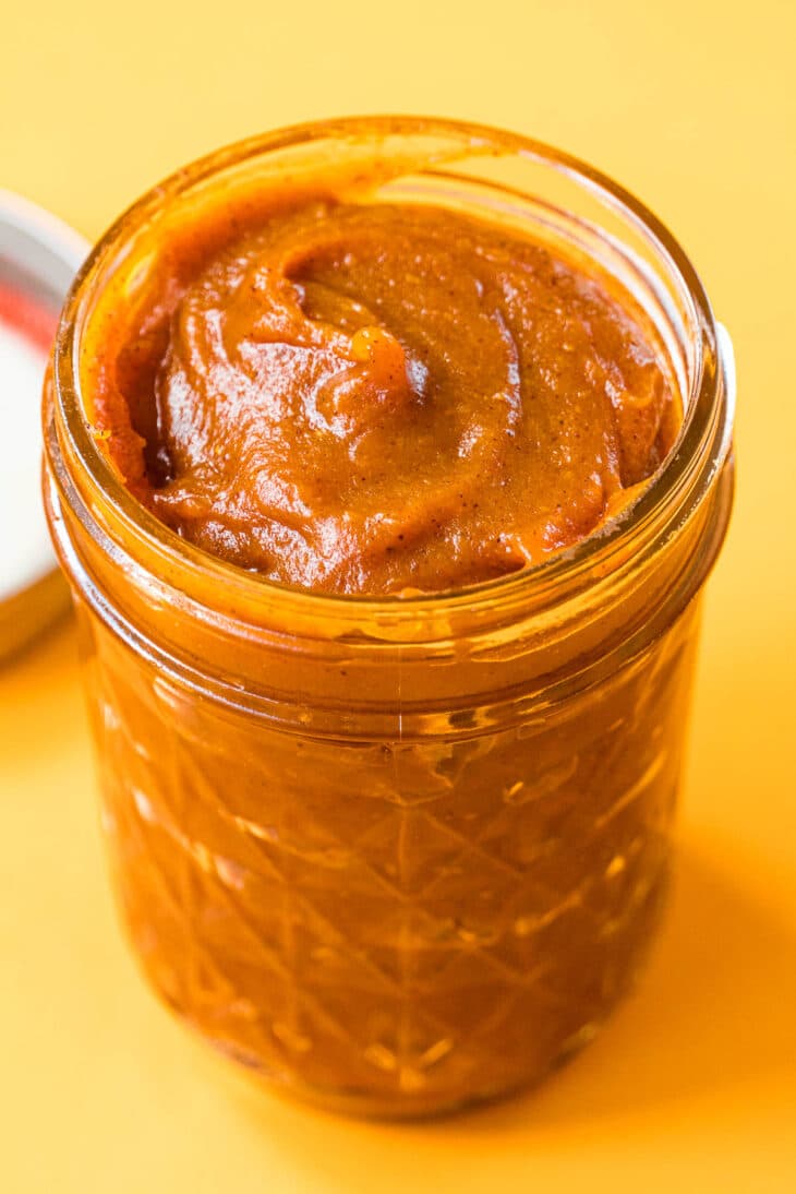 Pumpkin butter in a glass jar.