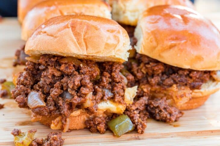 Sloppy joes on a board, ready to serve.