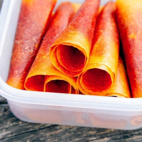 Mango Strawberry fruit leathers stacked in a container