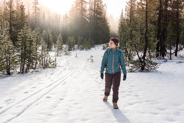 Megan hiking on a snow covered trail